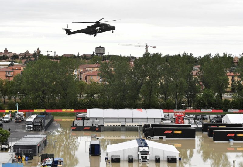 A helicopter flies above the closed Motor racing-Imola paddock, as Santerno river levels rise due to heavy rain, ahead of the weekend's Emilia Romagna Grand Prix, in Imola, Italy, May 17, 2023. REUTERS