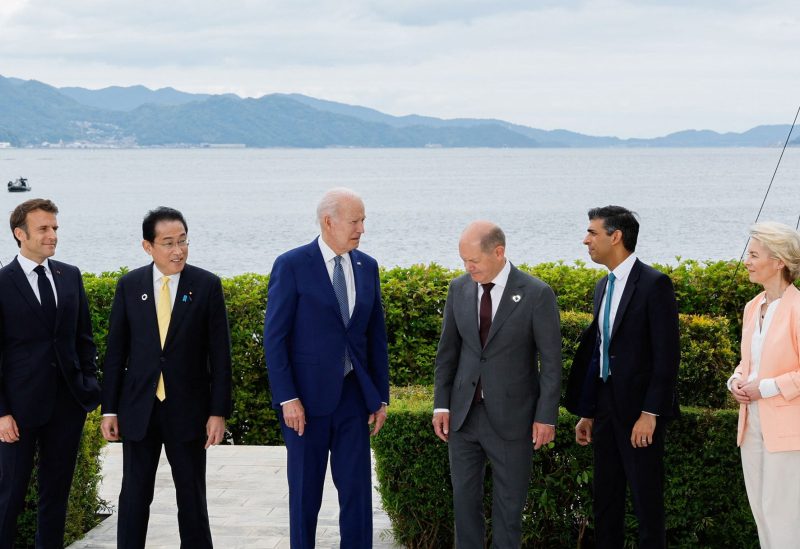 France's President Emmanuel Macron, Japan's Prime Minister Fumio Kishida, U.S. President Joe Biden, Germany's Chancellor Olaf Scholz, Britain's Prime Minister Rishi Sunak and European Commission President Ursula von der Leyen participate in a family photo with G7 leaders before their working lunch meeting on economic security during the G7 summit, at the Grand Prince Hotel in Hiroshima, Japan, May 20, 2023 - REUTERS