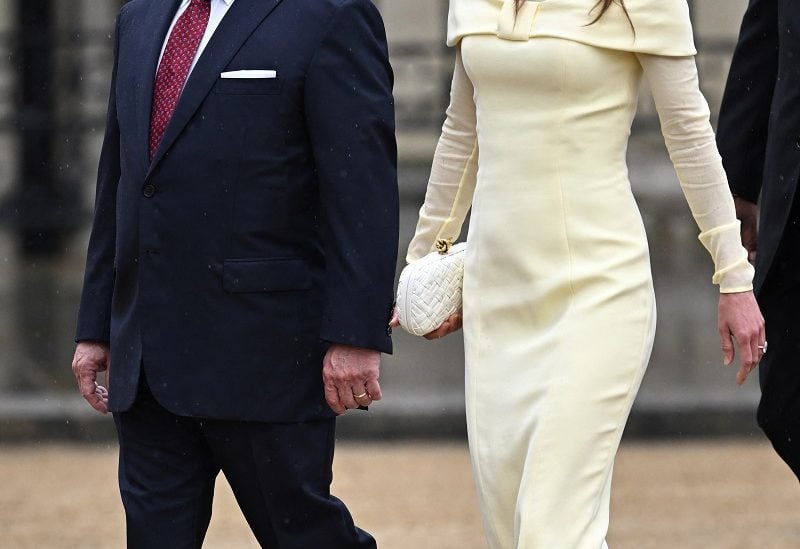 Jordan's King Abdullah and Queen Rania walk outside Westminster Abbey ahead of Britain's King Charles' coronation ceremony, in London, Britain May 6, 2023. REUTERS/Dylan Martinez