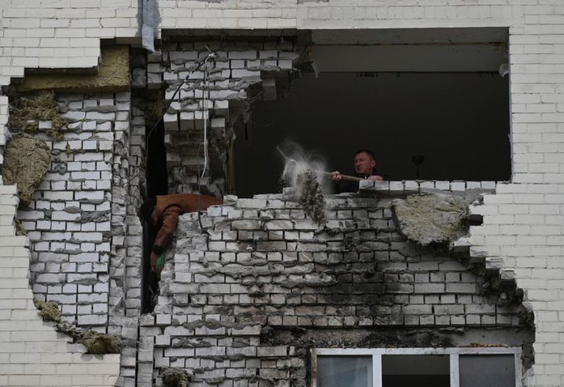 A local resident cleans from debris his apartment which was damaged by remains of a Russian missile, amid Russia's attack on Ukraine, in the town of Ukrainka, Kyiv region, Ukraine April 28, 2023. REUTERS