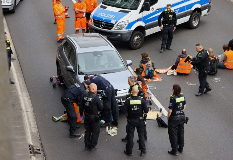 German police conduct raids on climate activists as impatience mounts