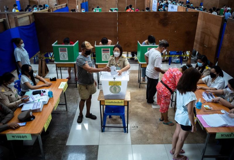 People cast their early vote for the upcoming Thailand's general election at a polling station in Bangkok, Thailand, May 7, 2023. REUTERS
