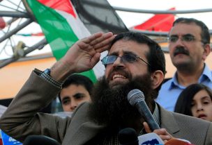 FILE PHOTO: Palestinian Islamic Jihad leader Khader Adnan gestures as he speaks during a rally honoring him following his release, near the West Bank city of Jenin July 12, 2015. Israel on Sunday released Adnan from jail following a deal last month in which he agreed to end a 56-day hunger strike, Islamic Jihad sources in the West Bank said. REUTERS/Abed Omar Qusini/File Photo