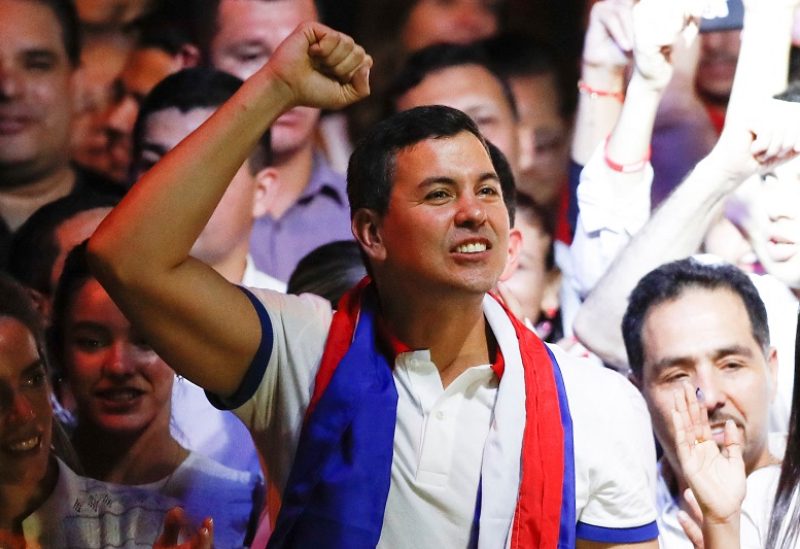 Paraguayan presidential candidate Santiago Pena from the ruling Colorado Party celebrates at the party headquarters as he and his running mate Pedro Alliana won Paraguay's presidential race, according to the preliminary official count, in Asuncion, Paraguay April 30, 2023. REUTERS/Agustin Marcarian