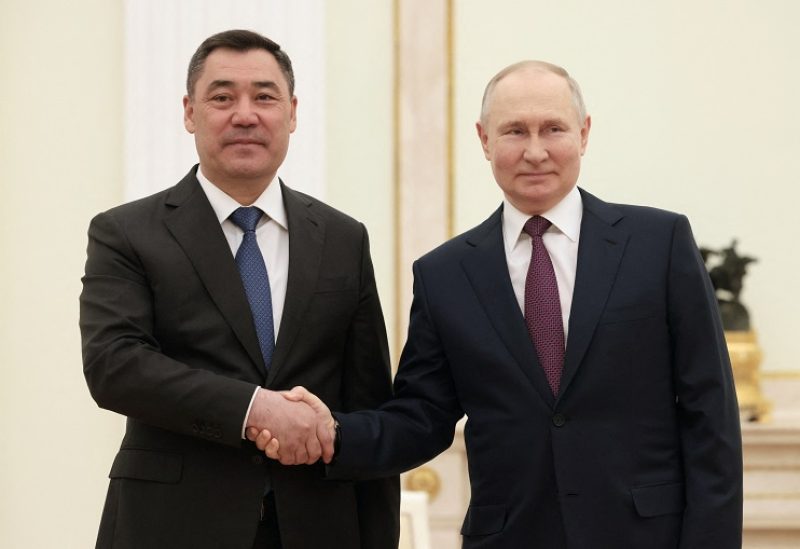 Russia's President Vladimir Putin shakes hands with Kyrgyzstan's President Sadyr Japarov during a meeting in Moscow, Russia May 8, 2023. Sputnik/Mikhail Metzel/Pool via REUTERS ATTENTION EDITORS - THIS IMAGE WAS PROVIDED BY A THIRD PARTY.