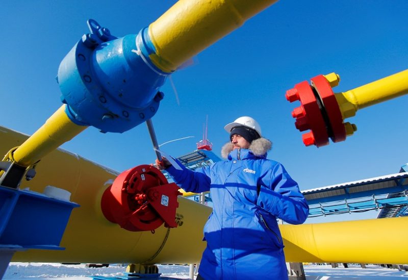 FILE PHOTO: An employee checks a gas valve at the Atamanskaya compressor station, part of Gazprom's Power Of Siberia gas pipeline outside the far eastern town of Svobodny, in Amur region, Russia November 29, 2019. REUTERS/Maxim Shemetov./File Photo