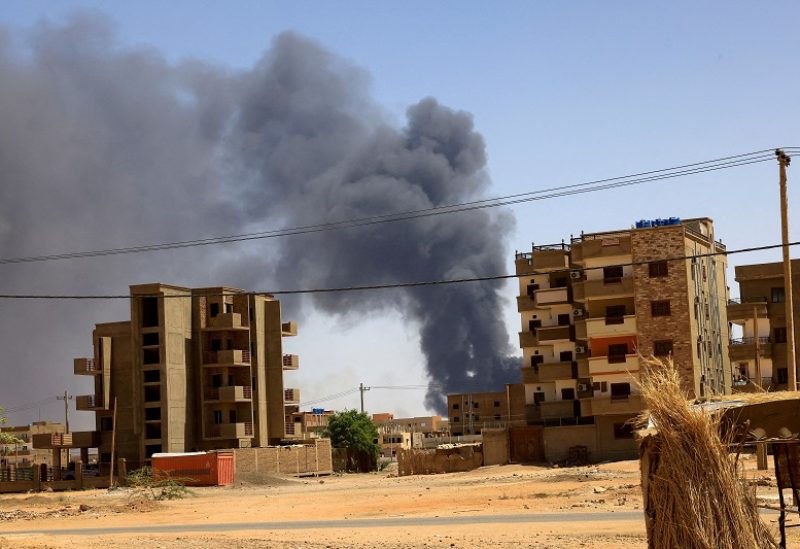 FILE PHOTO: Smoke rises above buildings after an aerial bombardment, during clashes between the paramilitary Rapid Support Forces and the army in Khartoum North, Sudan, May 1, 2023. REUTERS/Mohamed Nureldin Abdallah/File Photo
