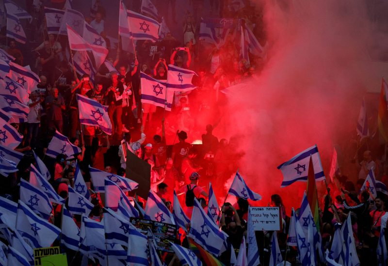 People take part in a demonstration against Israeli Prime Minister Benjamin Netanyahu and his nationalist coalition government's judicial overhaul, for the 20th consecutive week in Tel Aviv, Israel