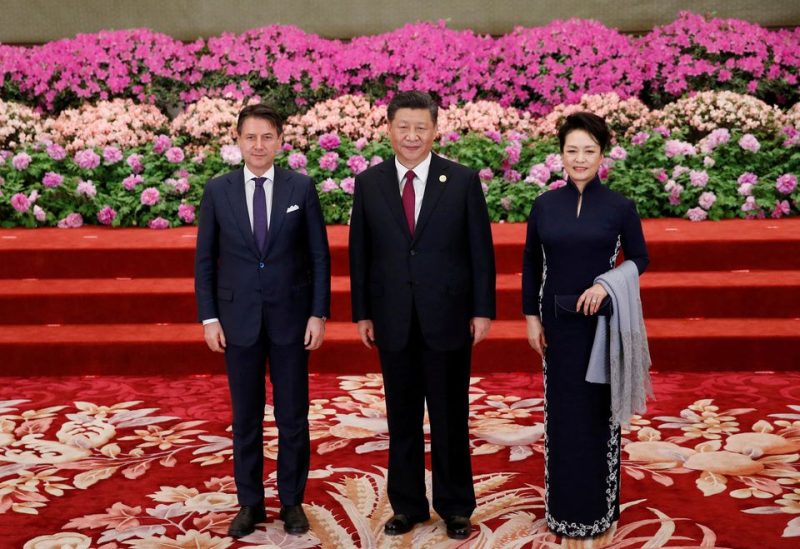 Then-Italian Prime Minister Giuseppe Conte (L) arrives to attend a welcoming banquet for the Belt and Road Forum hosted by Chinese President Xi Jinping and his wife Peng Liyuan at the Great Hall of the People in Beijing, China, April 26, 2019. REUTERS