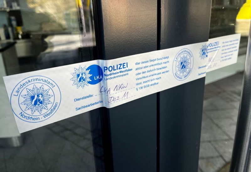 A police seal sticks at a door in Siegen, Germany, May 3, 2023