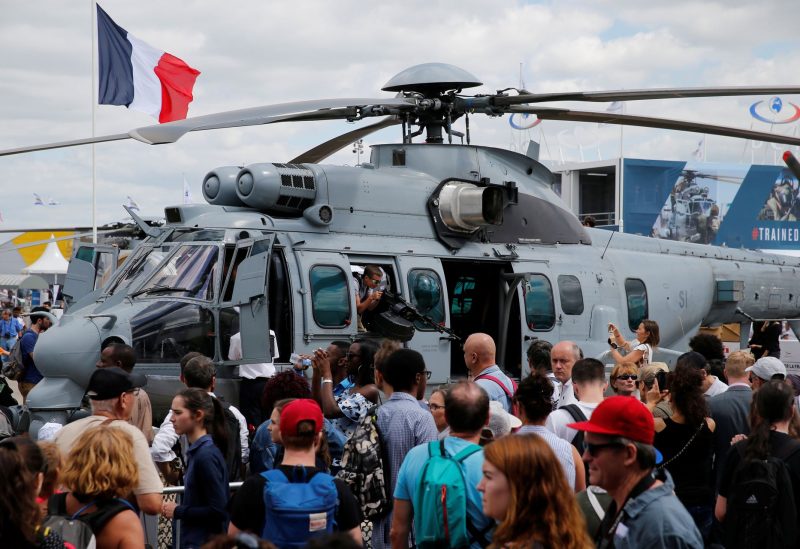 People look at an Airbus Helicopters H225M Caracal on the static display during the 52nd Paris Air Show at Le Bourget Airport, near Paris, France June 24, 2017. REUTERS
