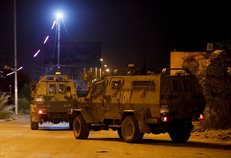 Israeli military vehicles operate in Jericho, in the Israeli-occupied West Bank May 25, 2023. REUTERS/Ammar Awad
