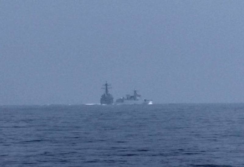 A People's Republic of China (PRC) warship, identified by the US Indo-Pacific Command as PRC LY 132, crosses the path of US Navy destroyer USS Chung-Hoon as it was transiting the Taiwan Strait with the Royal Canadian Navy frigate HMCS Montreal June 3, 2023, in a still image from video. (Global News via Reuters)