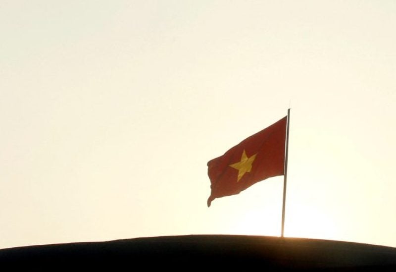 A Vietnamese national flag is seen on the rooftop of the National Assembly's Ba Dinh hall in Hanoi November 13, 2014. REUTERS/Kham/File Photo