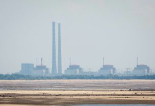 A view shows Zaporizhzhia Nuclear Power Plant from the bank of Kakhovka Reservoir near the town of Nikopol after the Nova Kakhovka dam breach in the Dnipropetrovsk region, Ukraine, June 16, 2023. REUTERS/Alina Smutko/File Photo