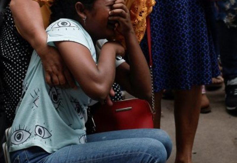 The relative of a victim of the deadly prison riot at the Centro Femenino de Adaptacion Social (CEFAS) women's prison is comforted as she reacts outside a morgue in Tegucigalpa, Honduras, June 21, 2023. REUTERS/Fredy Rodriguez