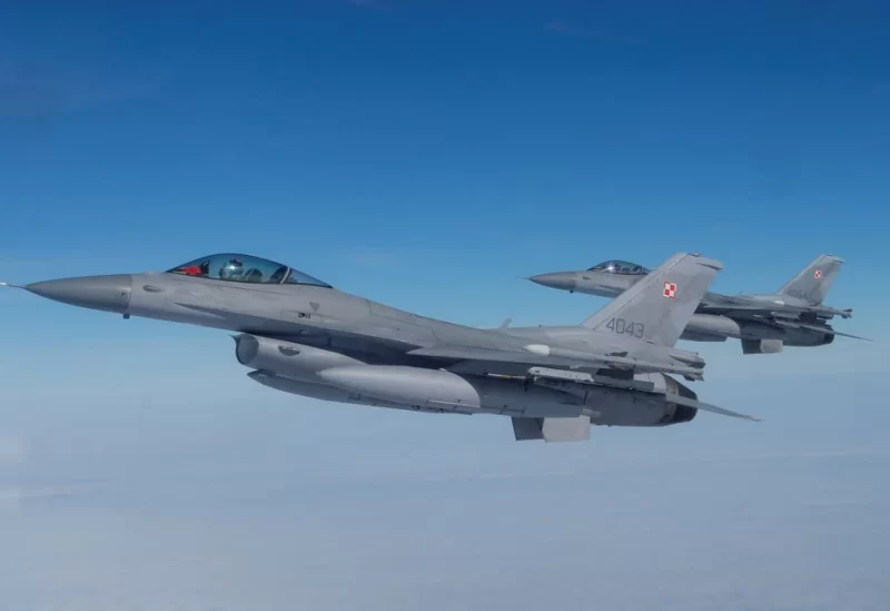 F-16 aircrafts fly during a NATO media event at an airbase in Malbork, Poland, March 21, 2023. REUTERS