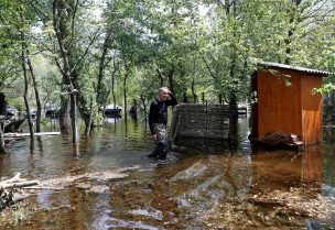 Ihor Medunov walks on a flooded island which locals and officials say is caused by Russia's chaotic control of the Kakhovka dam downstream, amid Russia's attack on Ukraine, near Zaporizhzhia, Ukraine, May 20, 2023. REUTERS/Bernadett Szabo