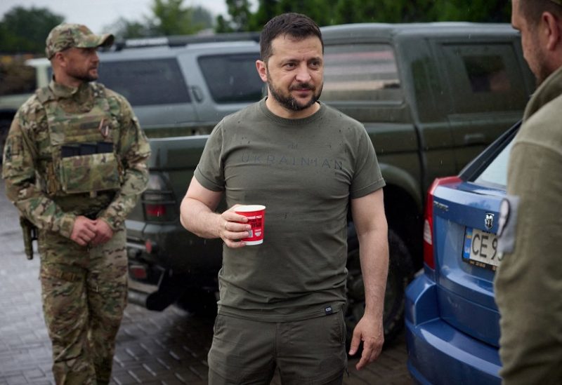 Ukraine's President Volodymyr Zelenskiy drinks coffee at a petrol station after visiting positions near the front line, amid Russia's attack on Ukraine, in Donetsk region, Ukraine June 26, 2023. Ukrainian Presidential Press Service/Handout via REUTERS ATTENTION EDITORS - THIS IMAGE HAS BEEN SUPPLIED BY A THIRD PARTY.