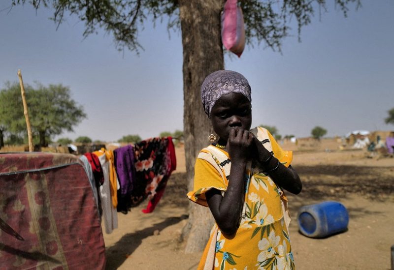 FILE PHOTO: Khadeedja, 7, a Sudanese refugee who has fled the violence in Sudan's Darfur region, looks on as she stands by her shelter, near the border between Sudan and Chad in Koufroun, Chad May 15, 2023. REUTERS/Zohra Bensemra/File Photo