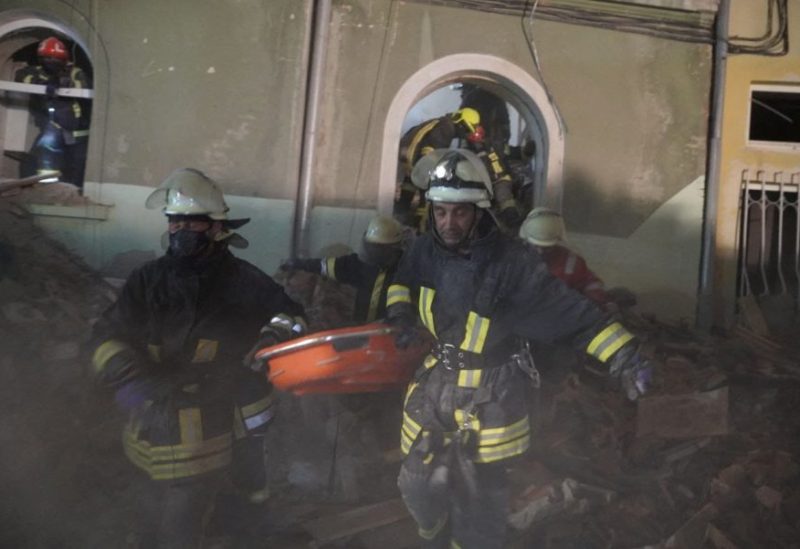 Rescuers carry the body of a person found under the debris of a residential building hit by a Russian missile strike, amid Russia's attack on Ukraine, in Lviv, Ukraine, in this handout picture released July 7, 2023. Press service of the State Emergency Service of Ukraine/Handout via REUTERS