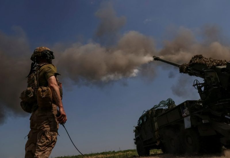 A Ukrainian serviceman of the 57th Kost Hordiienko Separate Motorised Infantry Brigade fires a 2S22 Bohdana self-propelled howitzer towards Russian troops, amid Russia's attack on Ukraine, at a position near the city of Bakhmut in Donetsk region, Ukraine July 5, 2023. REUTERS/Sofiia Gatilova/File Photo