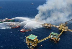 Boats spray water onto an offshore oil platform that caught fire at the Pemex's Cantarell Field, in the Bay of Campeche, Gulf of Mexico, Mexico July 7, 2023. Courtesy Petroleos Mexicanos (PEMEX) @Pemex/Handout via
