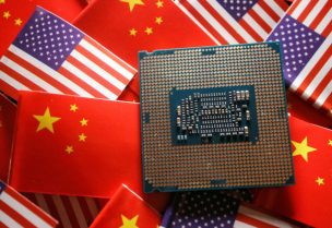 A central processing unit (CPU) semiconductor chip is displayed among flags of China and U.S., in this illustration picture taken February 17, 2023. REUTERS/Florence Lo/Illustration