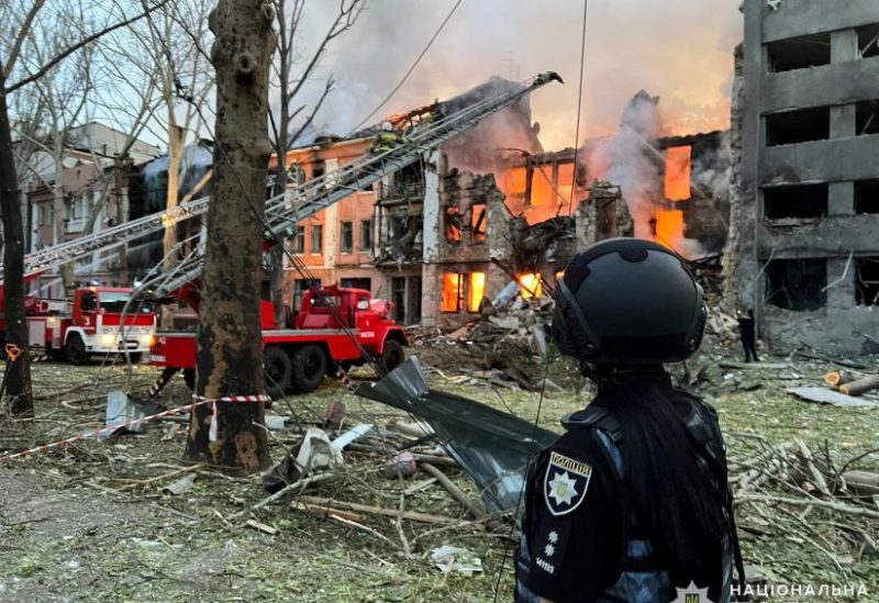 Emergency services personnel work at the site of a building that was damaged by a Russian missile strike, amid Russia's invasion of Ukraine, at a location given as Mykolaiv, Ukraine in this handout image released July 20, 2023. National Police of Ukraine/Handout via REUTERS