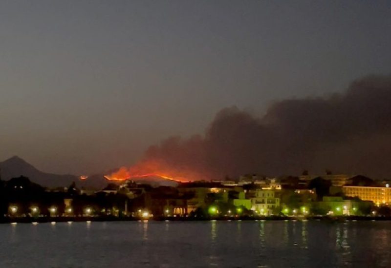 Smoke rises from a wildfire on Corfu Island, Greece, July 23, 2023 in this still image obtained from social media video. Julia Dzhyzhevska/via REUTERS