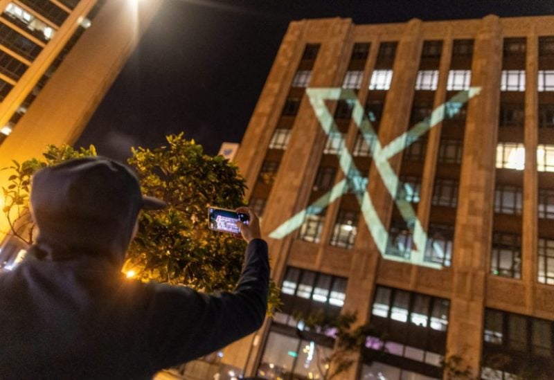 Twitter's new logo is seen projected on the corporate headquarters building in downtown San Francisco, California, U.S. July 23, 2023. REUTERS/Carlos Barria