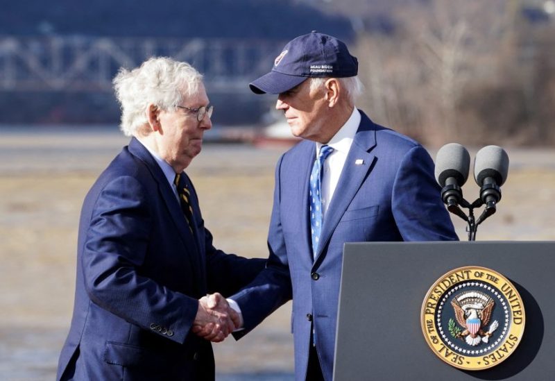 U.S. President Joe Biden shakes hands with U.S. Senate Republican Leader Mitch McConnell (R-KY) during an event to tout the new Brent Spence Bridge over the Ohio River between Covington, Kentucky and Cincinnati, Ohio near the bridge in Covington, Kentucky, U.S., January 4, 2023. REUTERS/Kevin Lamarque/File Photo