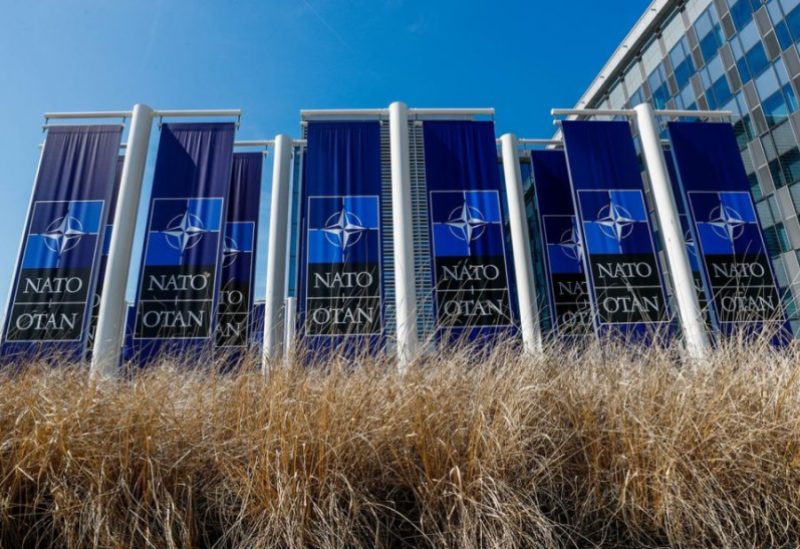 Banners displaying the NATO logo are placed at the entrance of new NATO headquarters during the move to the new building, in Brussels, Belgium April 19, 2018. REUTERS