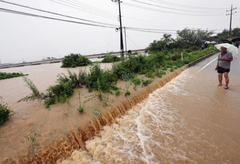A view of a road submerged by a flooded river caused by heavy rain in Cheongju, South Korea, July 15, 2023. Yonhap/via REUTERS