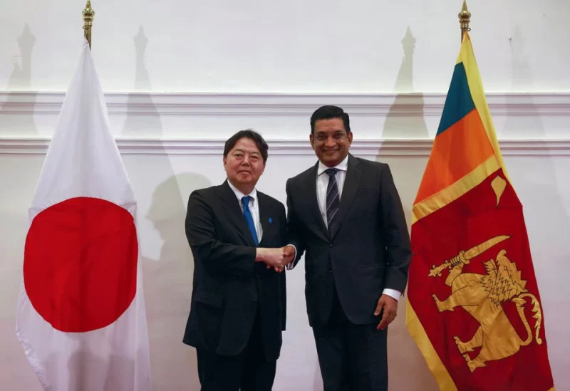 Japanese Foreign Minister Yoshimasa Hayashi poses for pictures with his Sri Lankan counterpart Ali Sabry following a bilateral meeting during his visit in Colombo, Sri Lanka July 29,2023. REUTERS