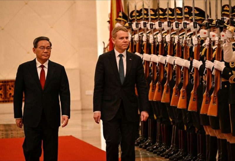China's Premier Li Qiang and New Zealand Prime Minister Chris Hipkins inspect the guard of honour during a welcoming ceremony at the Great Hall of the People in Beijing on June 28, 2023. JADE GAO/Pool via REUTERS