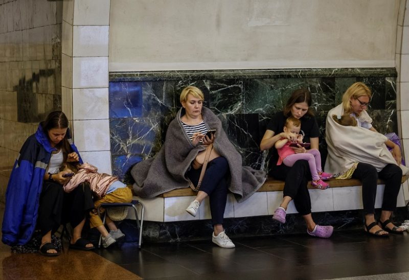Women take cover inside a subway station with their children, during an air raid alert, amid Russia's attack on Ukraine, in Kyiv, Ukraine, July 26, 2023. REUTERS/Alina Smutko