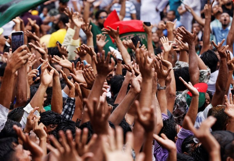 Supporters clap hands as they chant slogans while join in a rally organised by Bangladesh Nationalist Party (BNP), demanding the resign of the Bangladesh Awami League from the government, at Naya Palton area, in front of their office in Dhaka, Bangladesh, July 28, 2023. REUTERS/Mohammad Ponir Hossain