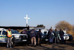 Police officers gather near the scene of a suspected gas leak thought to be linked to illegal mining, in the Angelo shack settlement, near Boksburg, east of Johannesburg, South Africa July 6, 2023. REUTERS/Siphiwe Sibeko