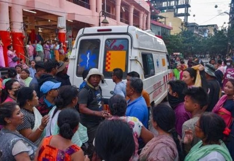 People gather around an ambulance carrying a body of a man killed in a violence between ethnic groups in northeastern state of Manipur, India, June 29, 2023. REUTERS/Stringer/File Photo