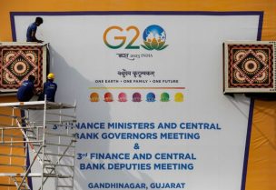 Workers work to install a hoarding board near the venue of G20 Finance Ministers and Central Bank Governors meeting at Gandhinagar in Gujarat, India July 13, 2023. REUTERS