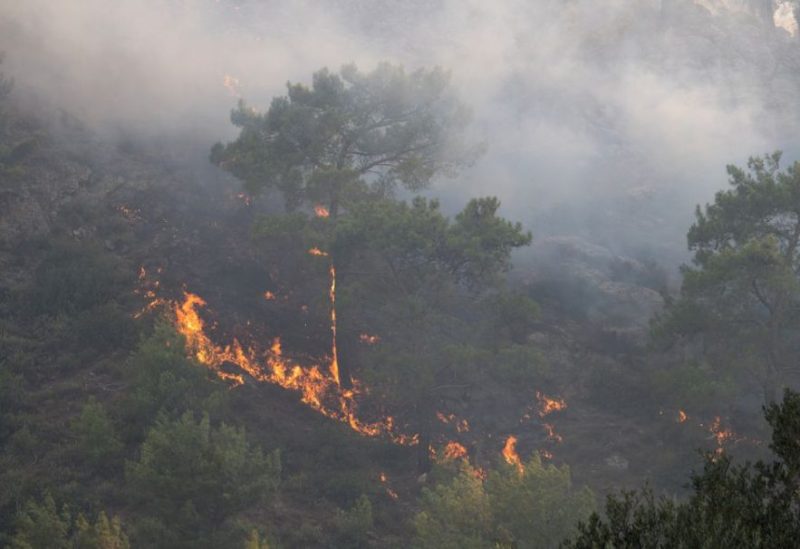 A wildfire burns in a forest near Lardos, on the island of Rhodes, Greece, July 22, 2023. REUTERS