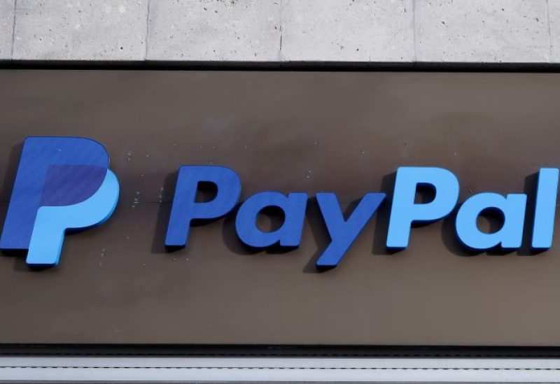 The PayPal logo is seen at an office building in Berlin, Germany, March 5, 2019. REUTERS/Fabrizio Bensch/File Photo