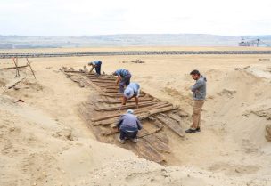 Archaeologists excavate the hull of a wooden ship, an ancient Roman flat-hulled riverine vessel at the ancient city of Viminacium, near Kostolac, Serbia, August 2, 2023. REUTERS/Zorana Jevtic