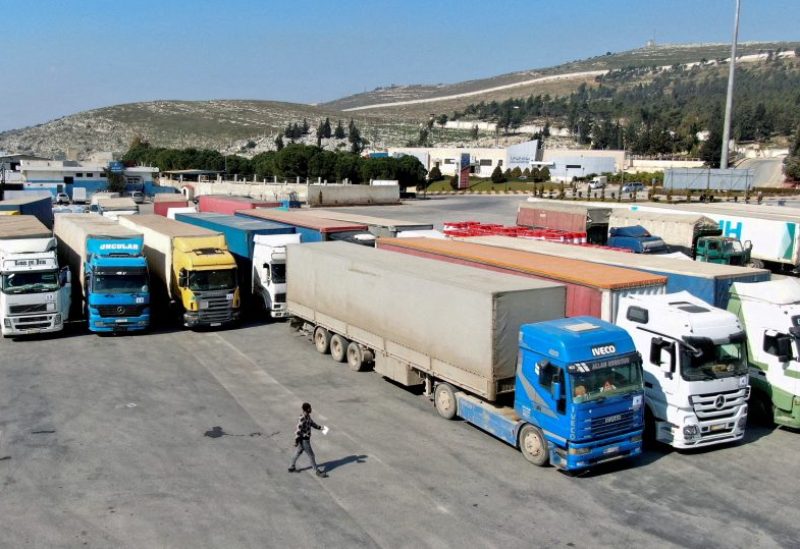 Trucks carrying aid from the UN World Food Programme (WFP), following a deadly earthquake, are parked at Bab al-Hawa crossing, Syria, February 20, 2023. REUTERS/Mahmoud Hassano//File Photo