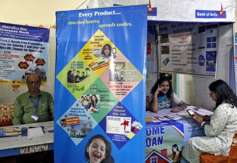 Bank employees wait for customers to offer loans at a "loan mela" or a loan fair organized by various Indian banks in New Delhi, India, October 4, 2019. REUTERS/Anushree Fadnavis/File Photo
