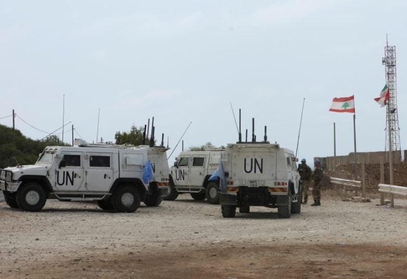 United Nations Interim Force in Lebanon (UNIFIL) members stand near their vehicles in Naqoura near the Lebanese-Israeli border, southern Lebanon, August 16, 2023. REUTERS/Aziz Taher