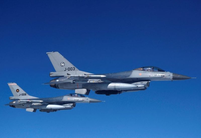 Netherlands' Air Force F-16 fighter jets fly during a media day illustrating how NATO Air Policing safeguards the Allies' airspace in the northern and northeastern region of the Alliance, July 4, 2023. REUTERS/Piroschka van de Wouw/File Photo