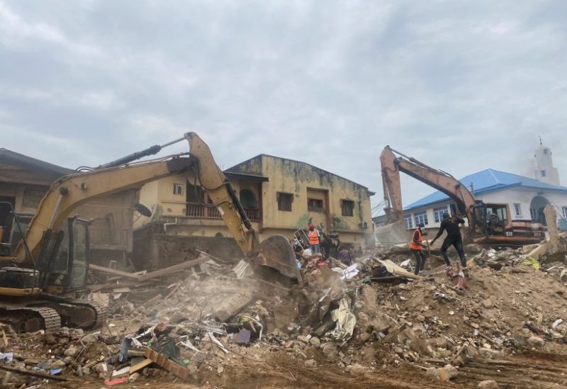 Rescue personnels search for survivors in the rubble of a two-storey building that collapsed, leaving two people dead and many trapped, according to authorities in Garki Abuja, Nigeria August 24, 2023. REUTERS/Abraham Achirga