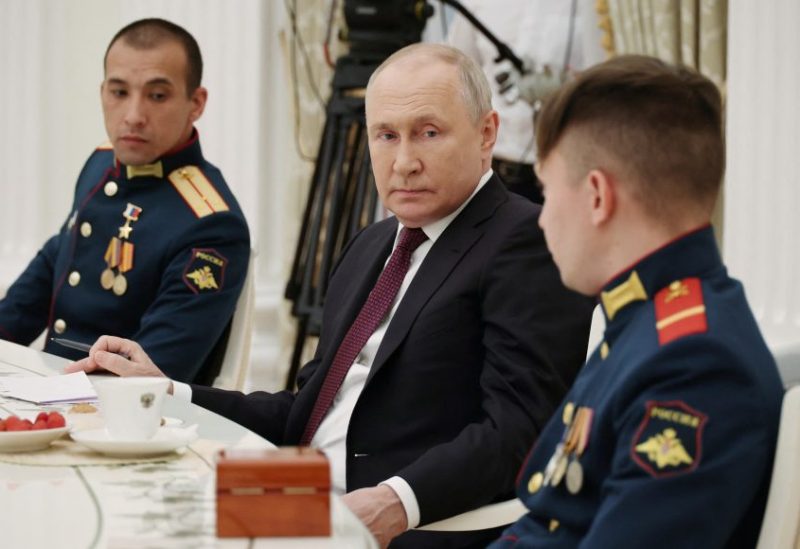 Russian President Vladimir Putin meets with the crew of the Alyosha T-80 tank, which destroyed a Ukrainian armoured convoy on the Zaporizhzhia direction in the course of Russia-Ukraine conflict, at the Kremlin in Moscow, Russia August 24, 2023. Sputnik/Mikhail Klimentyev/Kremlin via REUTERS